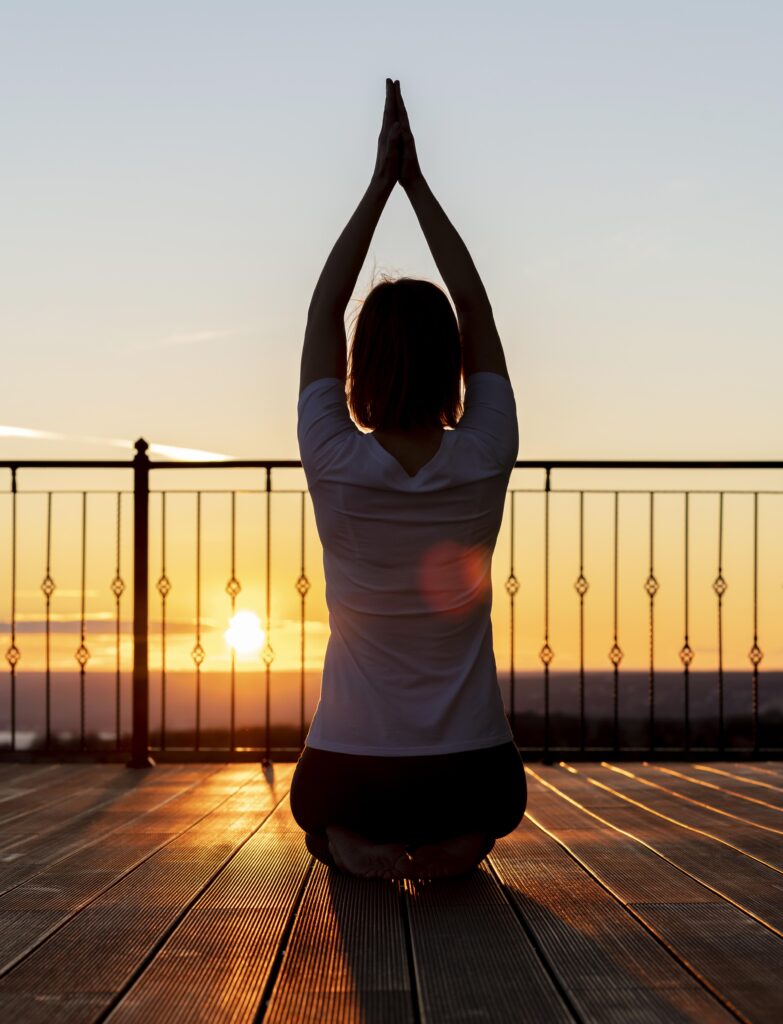 full shot woman meditating outdoors